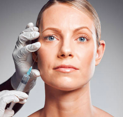 Image of a woman getting an injection near her eye area