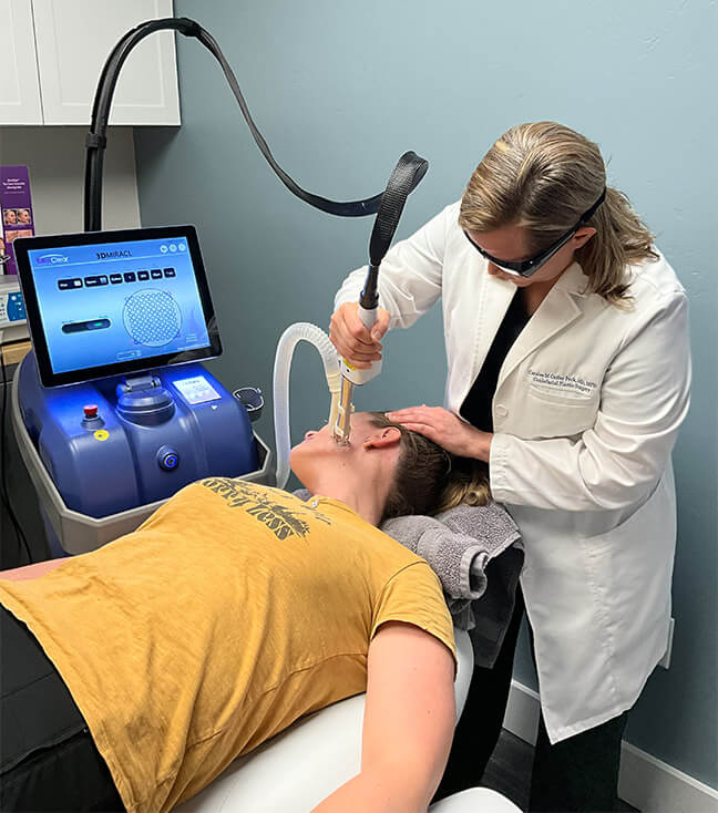 Image of Dr. Peck treating a patient with the UltraClear laser