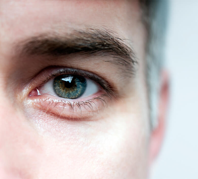 Closeup shot of man opening his eyes